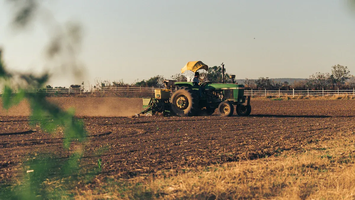 Tractor planting seeds in a field with modern agricultural machinery